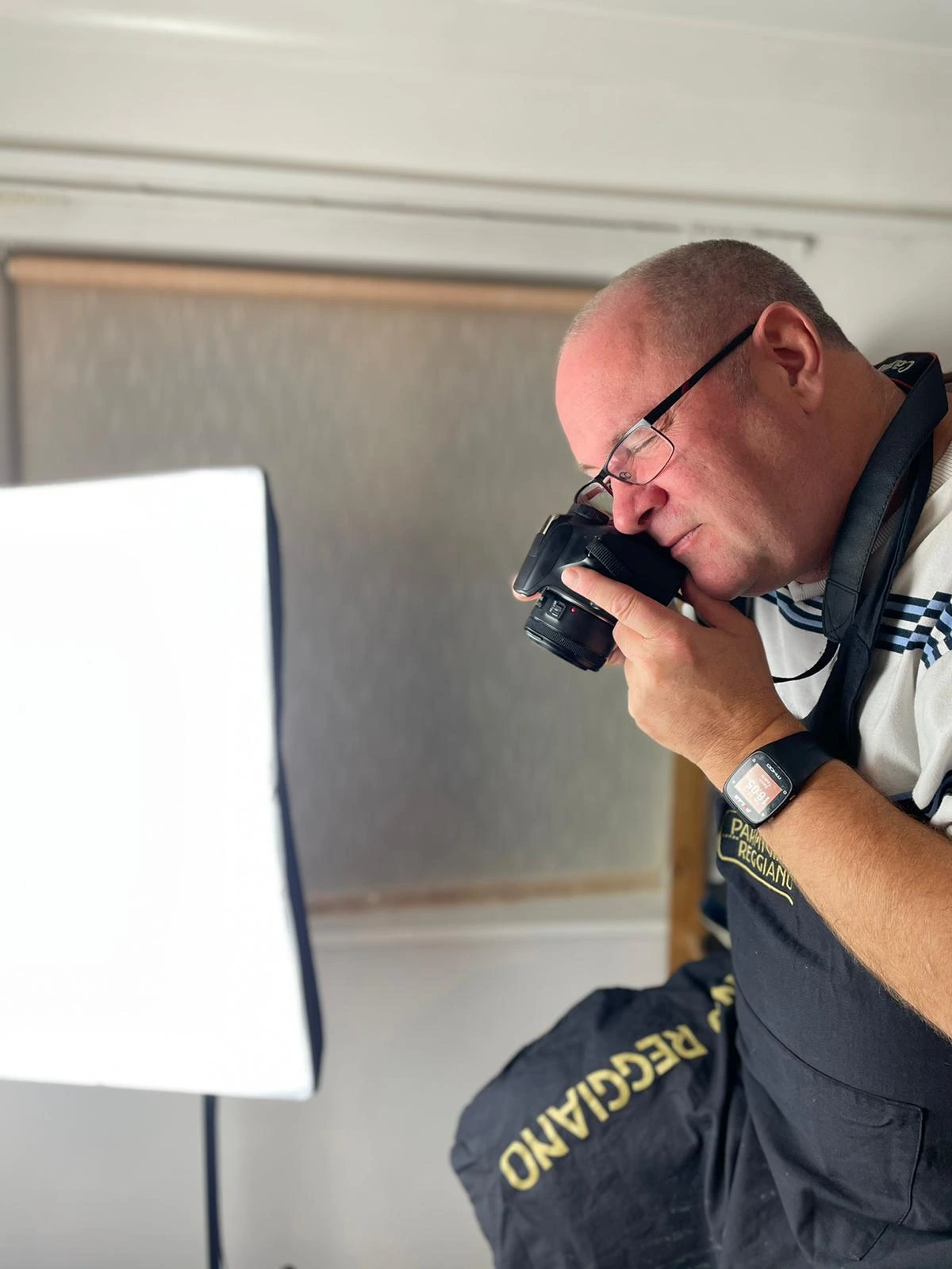 Photograph of Gav taking photos of his recipes and creations with a professional camera and lighting setup.